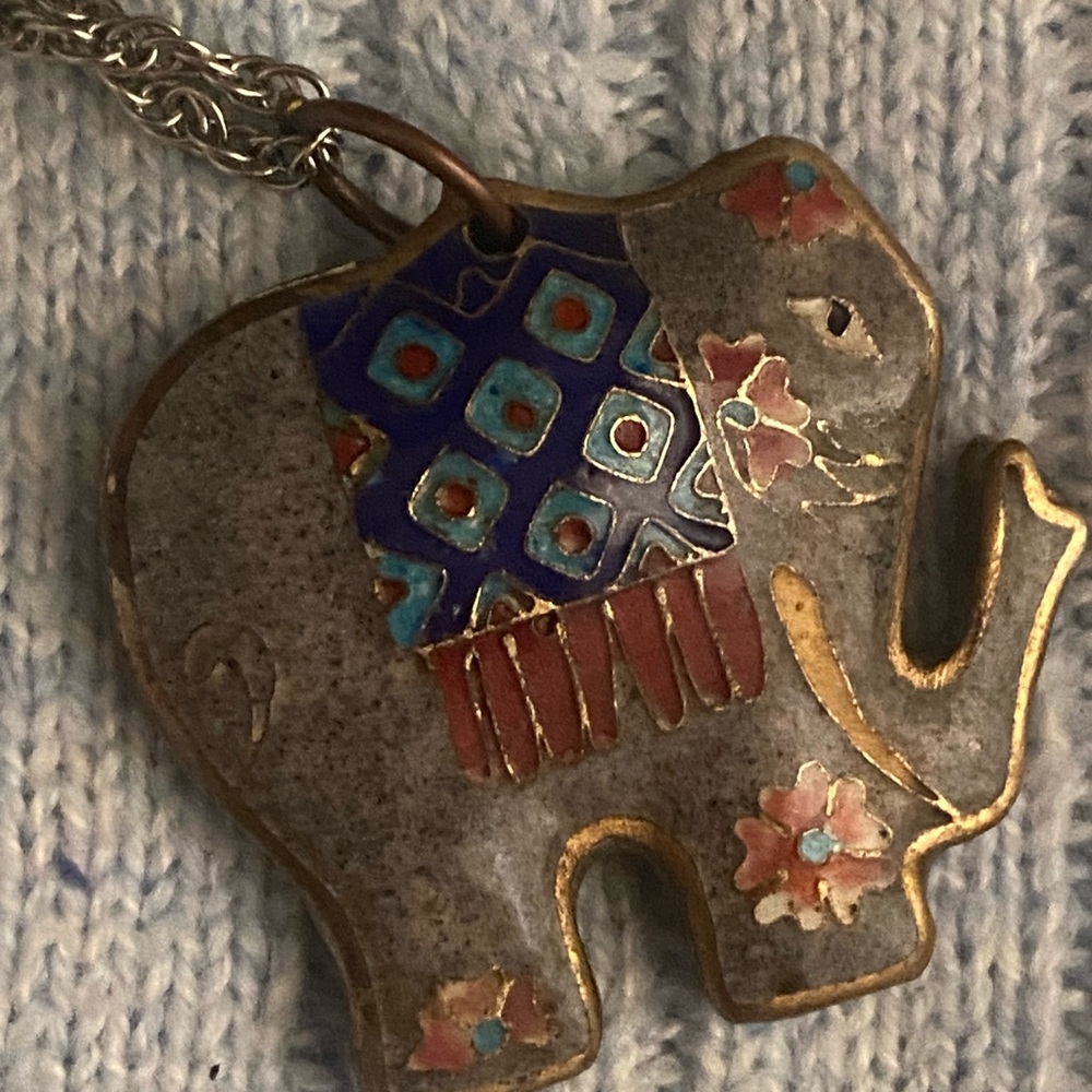 Artistic Elephant Pendant with Floral Accents